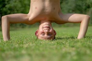 Boy doing handstand